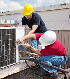 Technicians fixing air conditioning problems