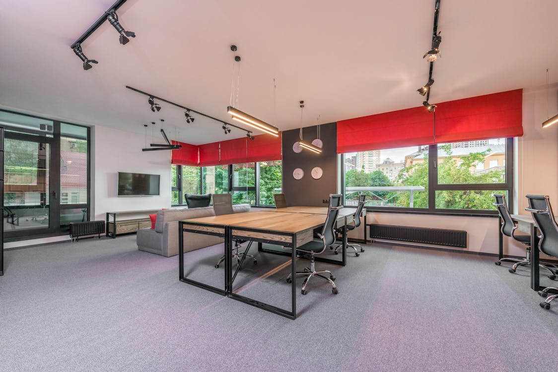 A modern, properly heated office space with employees working comfortably at their desks.